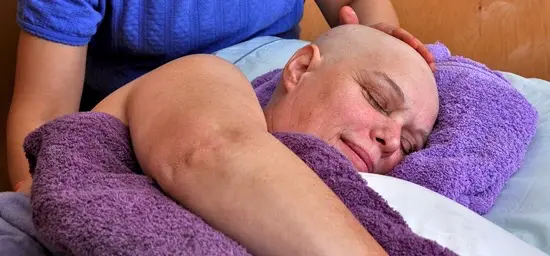A picture of a cancer patient receiving a massage